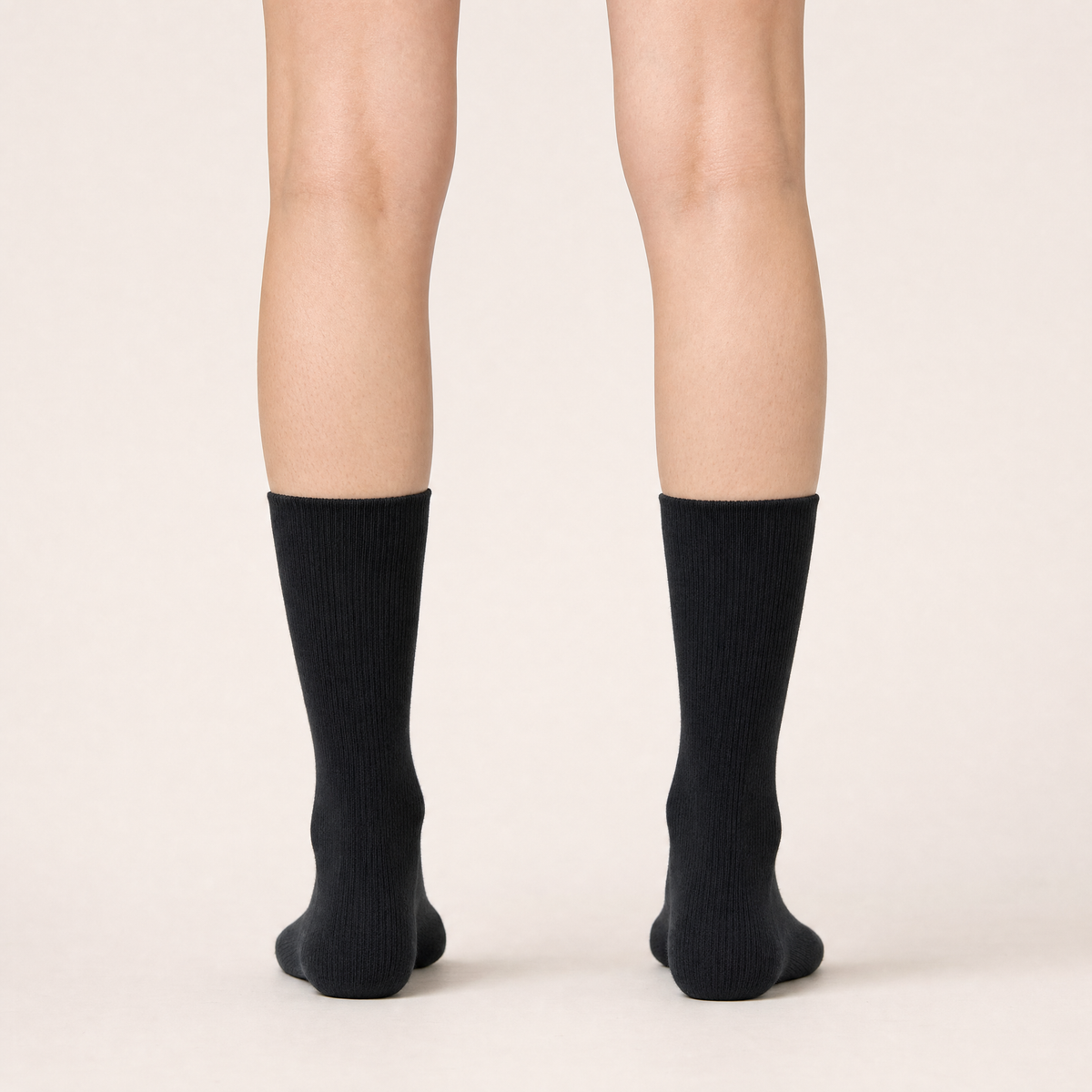 Black ribbed trouser socks worn, back view