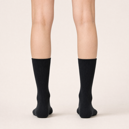 Black ribbed trouser socks worn, back view