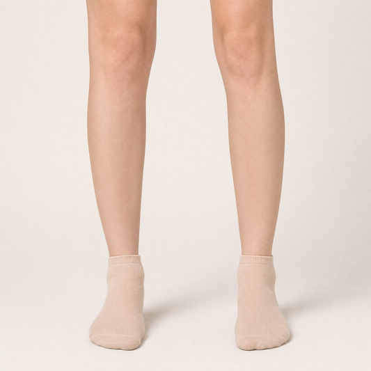 Sheer nude ankle socks worn, front view
